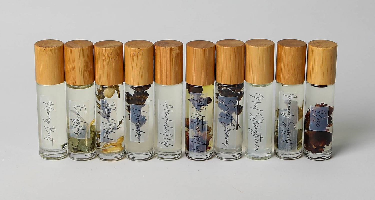 Three Essential Oil Roller laying on side, Roller 1 Eucalyptus, Roller 2 Rose, Roller 3 Lavender