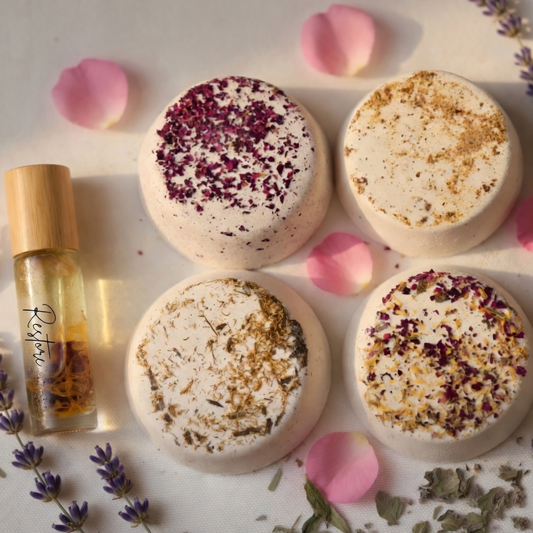 Aromatherapy essential oil roller with four luxury shower Steamers topped with rose petals and botanicals, natural handmade spa bath products