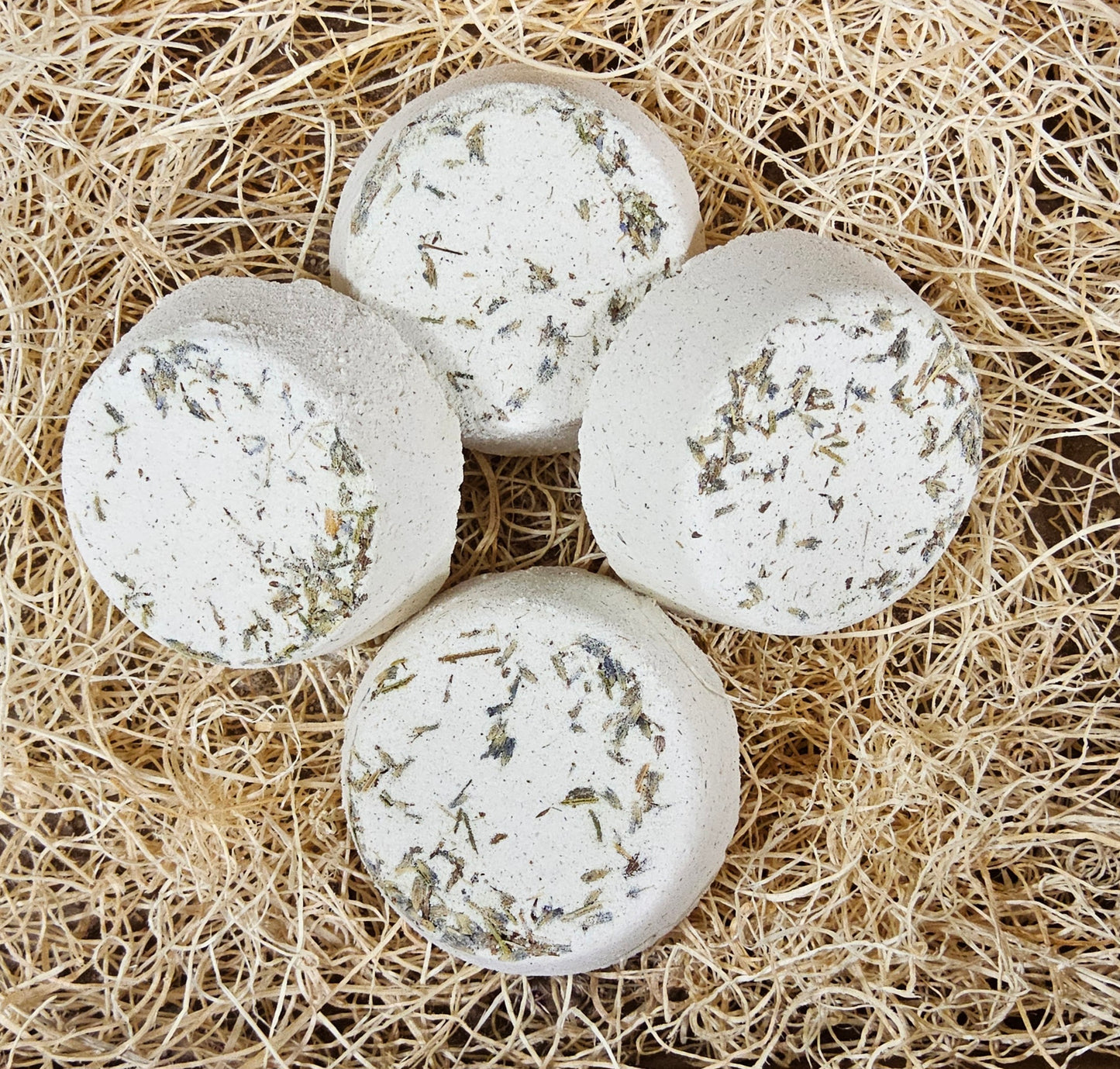 InspireByMK Lavender shower steamer made with pure lavender essential oil and lavender hydrosol, cream-colored handcrafted steamer with dried lavender leaves and stems for natural sleep support and relaxation