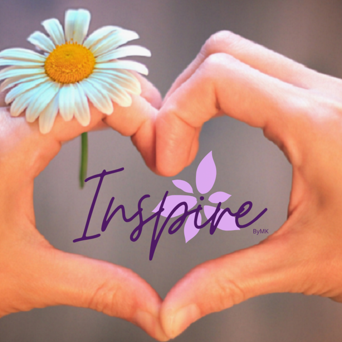 InspireByMK Inspire ByMK handcrafted aromatherapy brand logo featuring two hands forming heart shape holding white daisy flower with yellow center, purple script text with botanical leaf icon on gray background, women-owned natural wellness brand