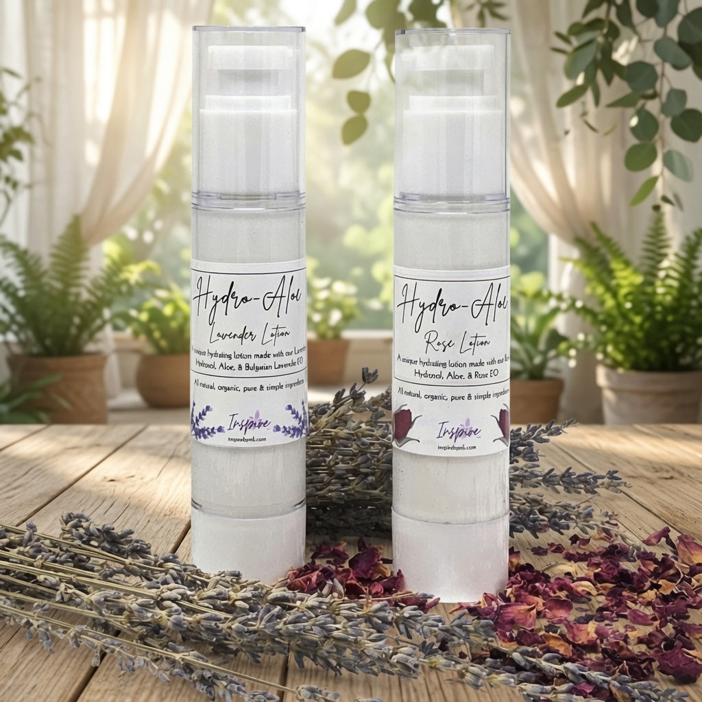 InspireByMK Hydro-Aloe Lavender & Rose Lotion, handcrafted all-natural hydrating lotion in airless pump bottles, made with hydrosol, aloe & essential oils, styled with dried lavender and rose petals on rustic wood, nourishing moisture for soft skin.
