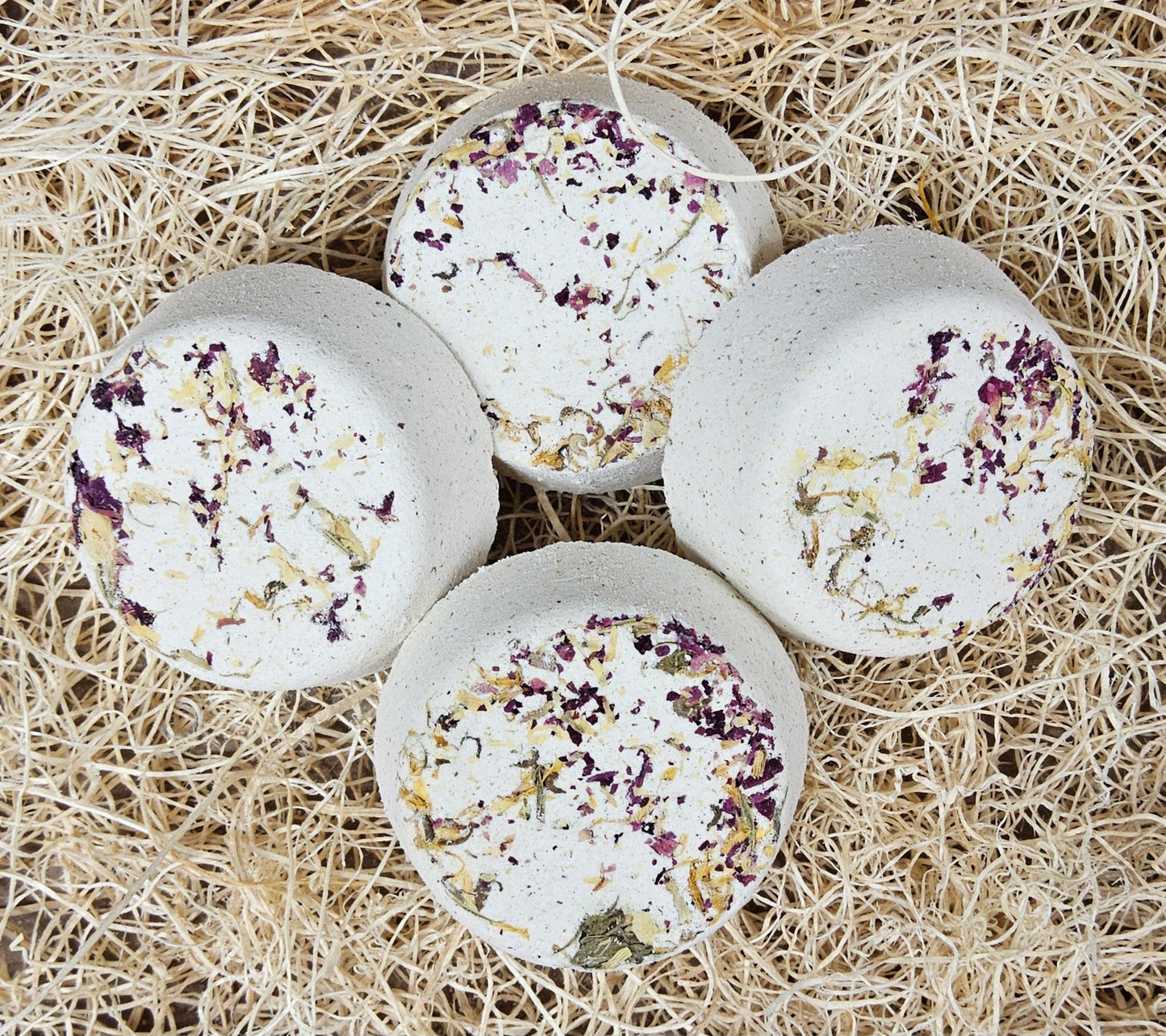 InspireByMK Restore shower steamer handcrafted essential oil blend of sandalwood, patchouli, and bergamot with rose hydrosol, cream-colored with dark purple and golden dried botanicals for grounding aromatherapy