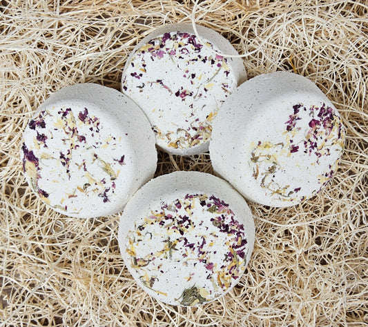 InspireByMK Restore shower steamer handcrafted essential oil blend of sandalwood, patchouli, and bergamot with rose hydrosol, cream-colored with dark purple and golden dried botanicals for grounding aromatherapy