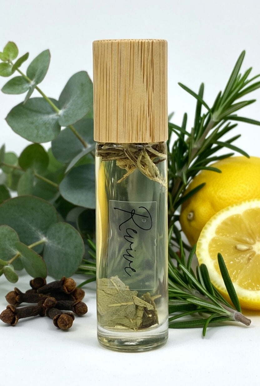 Revive essential oil roller with lemon, clove, eucalyptus, and rosemary. All natural energizing aromatherapy roller made with pure essential oils and dried botanicals for focus and vitality