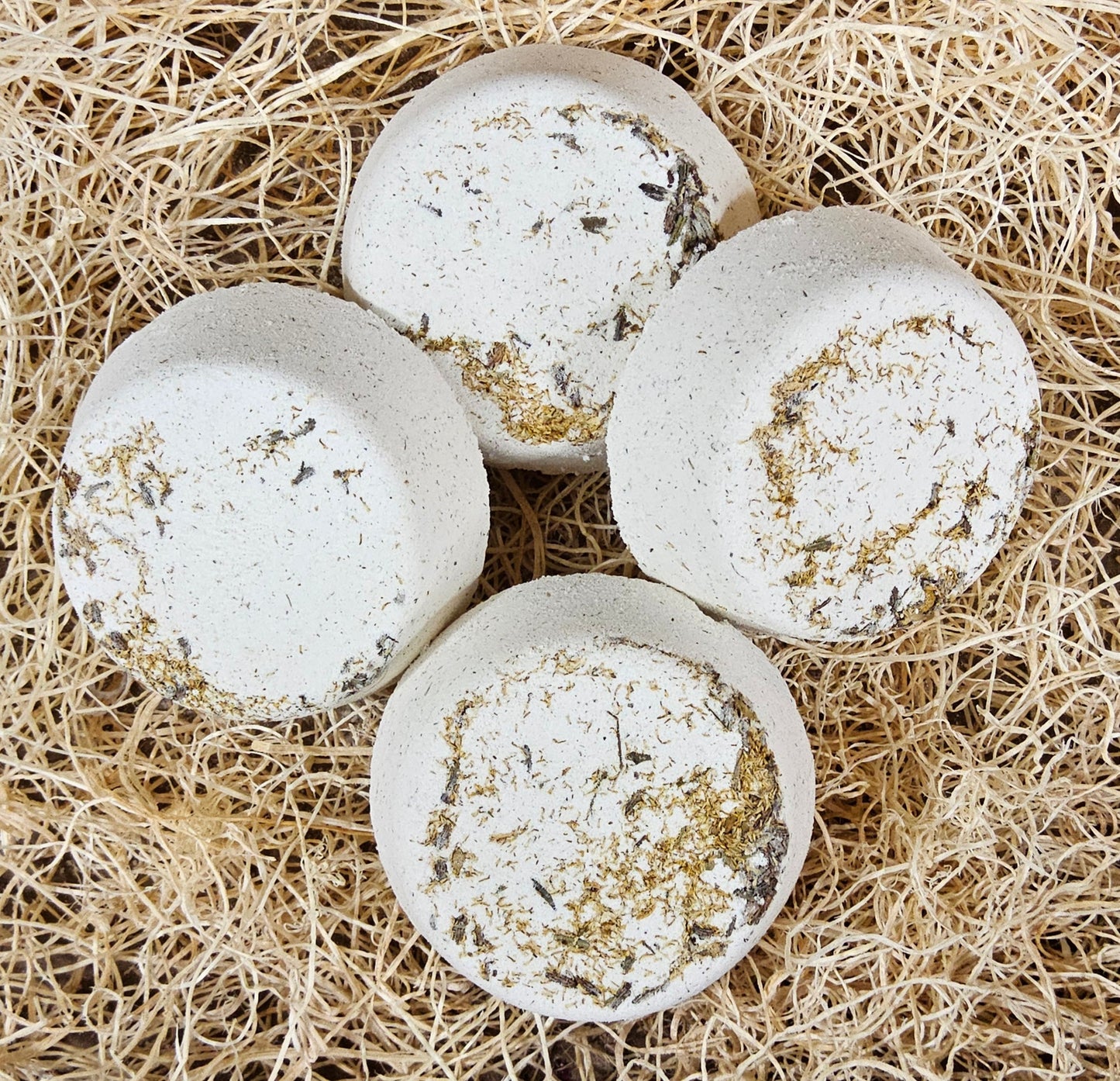 InspireByMK Tranquility shower steamer handcrafted essential oil blend of lavender, geranium, and chamomile with lavender hydrosol, cream-colored with dried botanicals for stress relief and relaxation