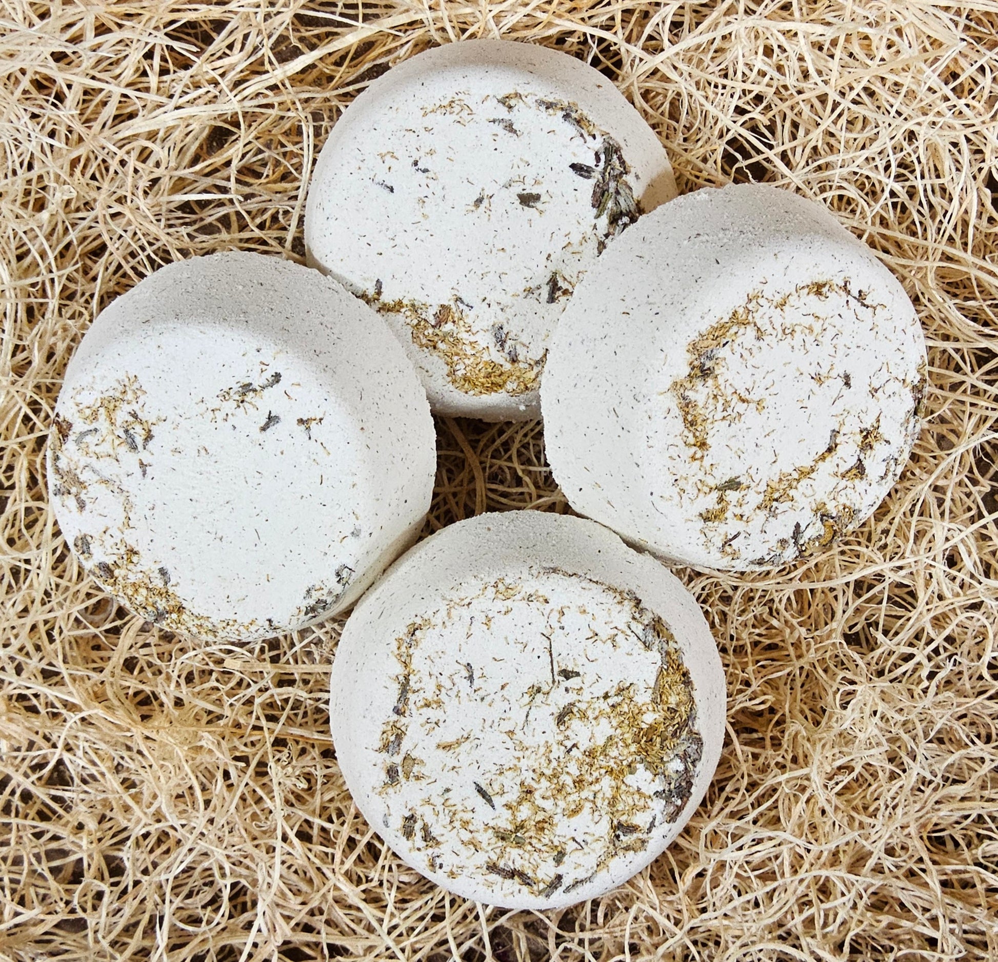 InspireByMK Tranquility shower steamer handcrafted essential oil blend of lavender, geranium, and chamomile with lavender hydrosol, cream-colored with dried botanicals for stress relief and relaxation