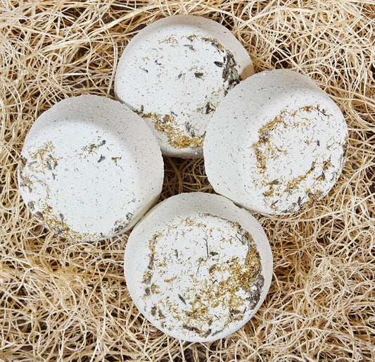 InspireByMK Tranquility shower steamer handcrafted essential oil blend of lavender, geranium, and chamomile with lavender hydrosol, cream-colored with dried botanicals for stress relief and relaxation